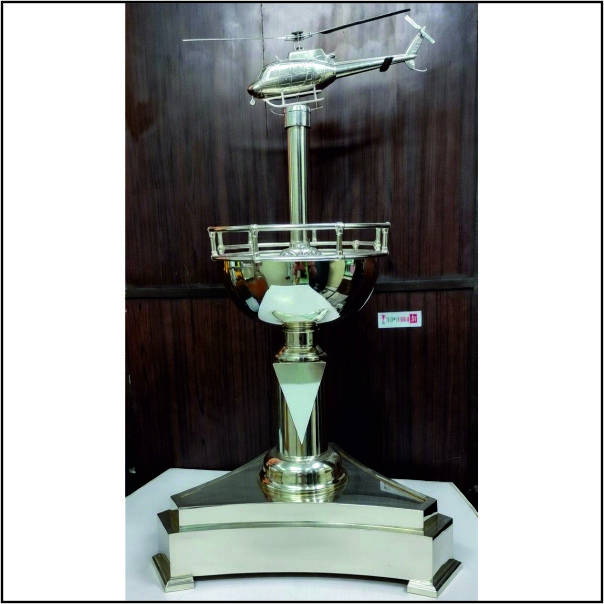 "The Sky Warrior: Premium Silver-Plated Helicopter Memento with Helipad Base"